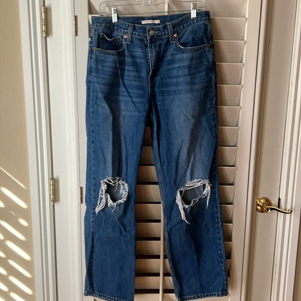 Size 29, Levi’s low pro straight leg jeans, distressed knees